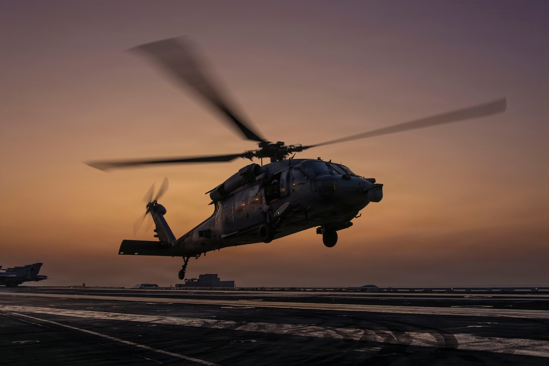 An MH-60S Sea Hawk helicopter, attached to Helicopter Sea Combat Squadron (HSC) 14, takes off on the flight deck of Nimitz-class aircraft carrier USS Abraham Lincoln (CVN 72) in support of Operation Epic Fury, March. 4, 2026. (U.S. Navy photo)