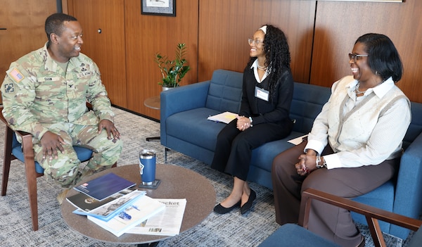 Harmoni Sanders, Mary G. Montgomery High School student, center, listens as U.S. Army Corps of Engineers, Mobile District, commander Col. Kelcey Shaw speaks about the District with LaTonya Campbell, program analyst, at the District headquarters in Mobile, Alabama, Feb. 19, 2026. Shaw explained the benefits of USACE and the opportunities a career with the agency can offer. (U.S. Army photo by Keesha Robinson)