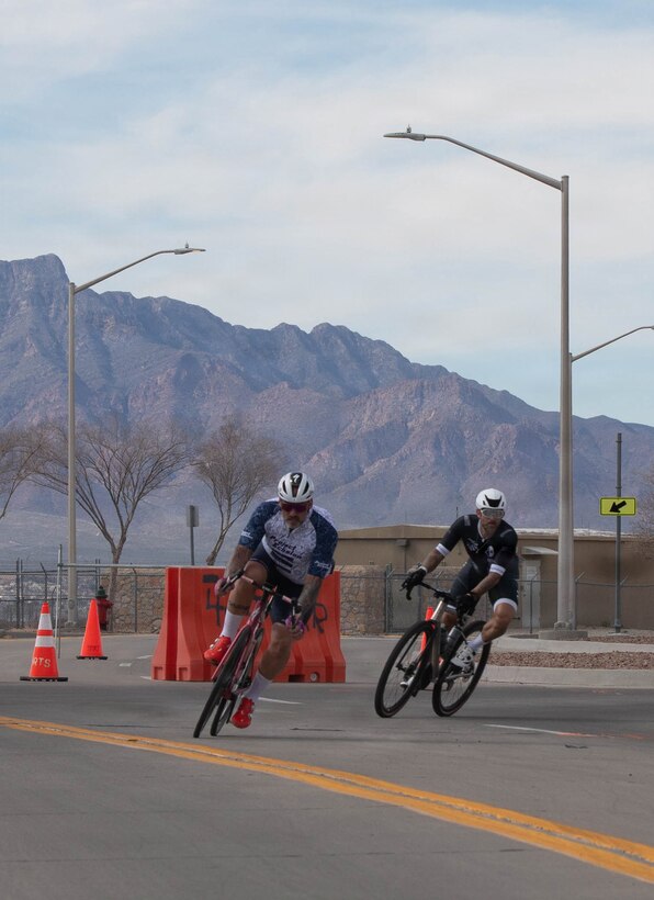 Cyclists round a corner during a one-mile bicycle time trial as part of Army Trials 2026, March 1, 2026, at Fort Bliss, Texas.