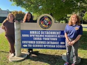 251002-N-N1574-1001 YORKTOWN, Va. (Oct.  2, 2025) Jaime Lesson, a prescription eyeglass maker  with the Specials Department at Naval Ophthalmic Readiness Activity’s (NORA), and a Lean Six Sigma Black Belt trainee, Carolyn Thomas, NORA’s Special’s Department Lead and a Lean Six Sigma Black Belt trainee, with Navy Medical Forces Atlantic (NMFL),  Naval Medical Readiness Logistics Command (NMRLC) det NORA and Terri Shambach, NMFL’s Improvement Sciences Director and Lean Six Sigma Master Black Belt, gather for a photo outside of the NMRLC Detachment NORA after Lesson and Thomas earned their Lean Six Sigma Greenbelt Certification, Oct. 2, 2025. Lean Six Sigma is a combined, data-driven methodology aimed at maximizing efficiency, reducing waste, and minimizing process variation to enhance quality and customer satisfaction. (U.S. Navy photo by Hospital Corpsman First Class Ericka Garnes)