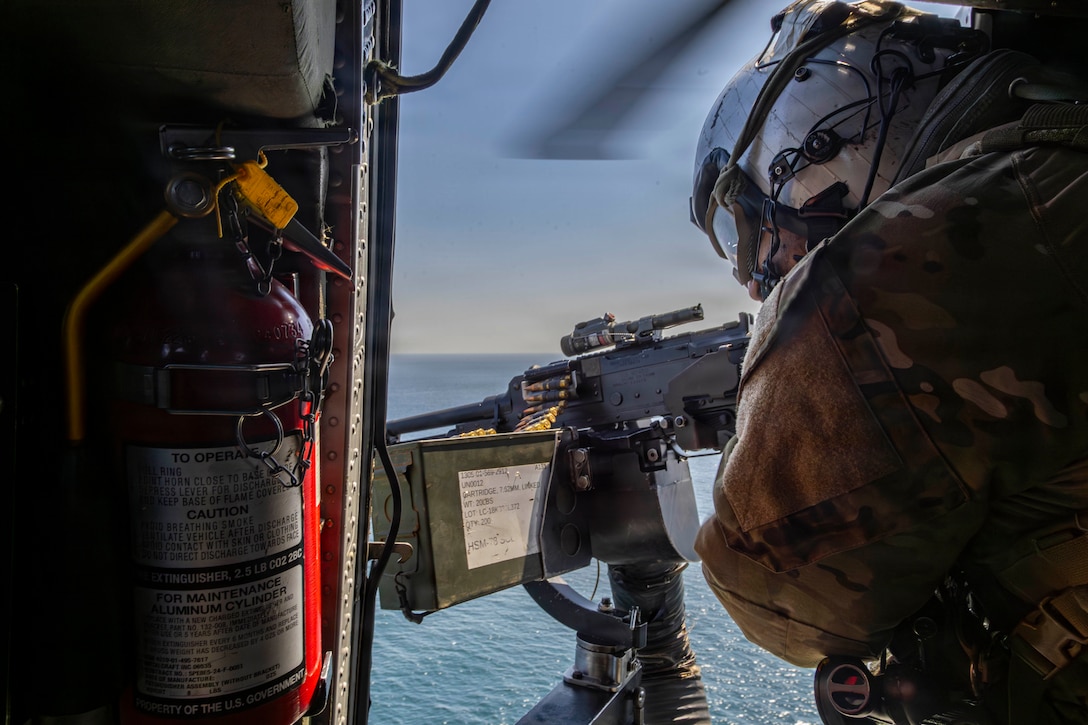 A U.S. Navy Sailor conducts flight operations in an MH-60S Sea Hawk helicopter, attached to Helicopter Sea Combat Squadron (HSC) 14, above Nimitz-class aircraft carrier USS Abraham Lincoln (CVN 72) in support of Operation Epic Fury, March 3, 2026. (U.S. Navy photo)