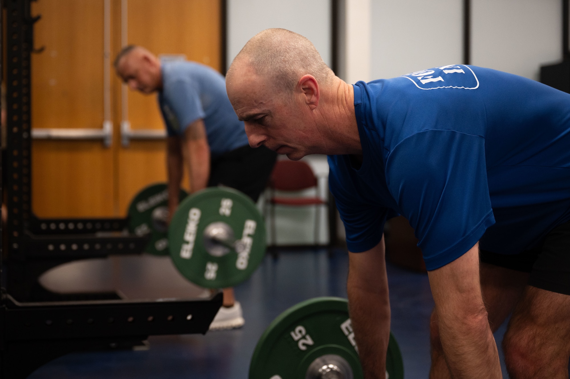 U.S. Air Force Maj. Gen. Steven Behmer, 15th Air Force commander, right, and Chief Master Sgt. Nikki Drago, 15th Air Force command chief, left, perform Romanian deadlifts at Davis-Monthan Air Force Base, Arizona, Feb. 27, 2026. Behmer and Drago exercised with Airmen from the 48th and 68th Rescue Squadrons before touring the installation. (U.S. Air Force photo by Airman 1st Class Jaden Kidd)