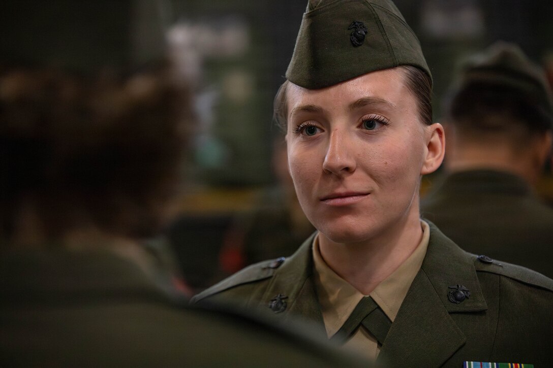 U.S. Marine Corps Cpl. Ashleigh Porter, an administrative clerk with Headquarters Battalion, Marine Forces Reserve, stands at the position of attention during a service alpha uniform inspection, Marine Corps Support Facility New Orleans, Feb. 27, 2026. The inspection was conducted to evaluate the Marines’ appearance and adherence to standards while promoting discipline and attention to detail. (U.S. Marine Corps photo by Lance Cpl. Van Hoang)