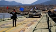 Republic of Korea Army 5th Engineer Brigade, K1A2 tank crosses a U.S. Army Improved Ribbon Bridge (IRB) during  joint wet gap training as part of Freedom Shield 25 at Yeoncheon-gun, Republic of Korea, on March 20, 2025.