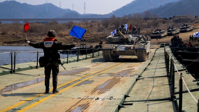 Republic of Korea Army 5th Engineer Brigade, K1A2 tank crosses a U.S. Army Improved Ribbon Bridge (IRB) during  joint wet gap training as part of Freedom Shield 25 at Yeoncheon-gun, Republic of Korea, on March 20, 2025.