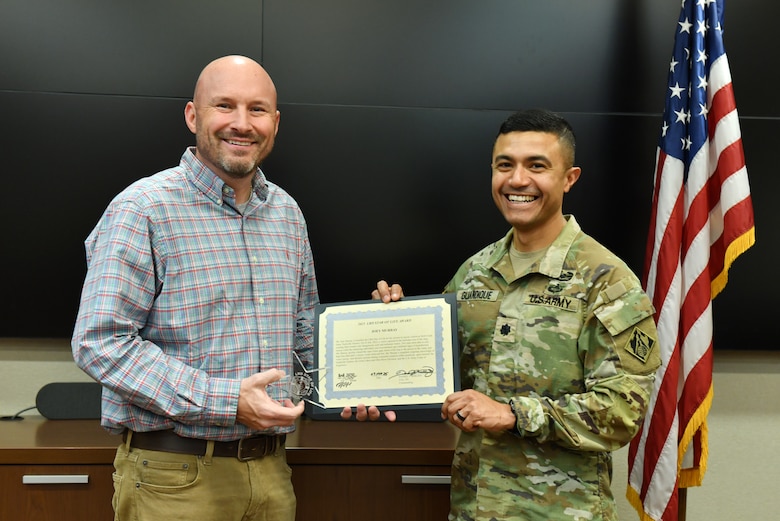 Lt. Col. Guillermo Guandique (Right), U.S. Army Corps of Engineers Nashville District commander (Right), presents the 2025 Star of Life Award March 5, 2026, from the USACE Great Lakes and Ohio River Division commander to Joey Murray during a ceremony at the district headquarters in Nashville, Tennessee. The award recognizes his effort to rescue a person thrown overboard into cold and turbulent water below Wolf Creek Dam July 25, 2025, on the Cumberland River in Jamestown, Kentucky. (USACE Photo by Summer Thatcher)