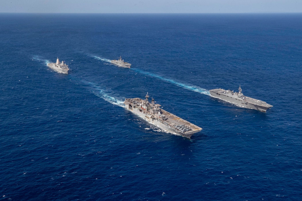 San Antonio-class amphibious transport dock ship USS New Orleans (LPD 18), top, left, Japan Maritime Self-Defense Force (JMSDF) Ōsumi-class tank landing ship JS Ōsumi (LST 4001), top, right, and JMSDF Hyūga-class helicopter destroyer JS Ise (DDH 182), bottom, right, sail in formation alongside America-class amphibious assault ship USS Tripoli (LHA 7) during exercise Iron Fist, March 1, 2026.