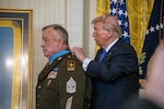 President Donald Trump awards the Medal of Honor to retired U.S. Army Command Sgt. Maj. Terry P. Richardson during a White House ceremony in Washington, D.C., March 2, 2026. Richardson was awarded the Medal of Honor for acts of conspicuous gallantry and intrepidity at the risk of his life above and beyond the call of duty, Sept. 14, 1968, while he was a Staff Sgt. serving as the Lima Platoon Leader with Company A, 1st Battalion, 28th Infantry Regiment, 1st Infantry Division during action in the vicinity of Loc Ninh, Republic of Vietnam. (U.S. Army photo by Christopher Kaufmann)