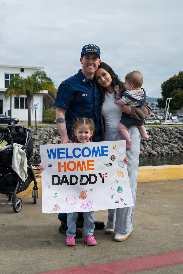 Chief Petty Officer Matthew Smith, a crew member aboard USCGC Munro (WMSL 755) is greeted by his family during the cutter’s return to home port in Alameda California, March 1, 2026. Munro and its crew departed Alameda on November 3, 2025 and traveled over 26,000 miles during their patrol. (U.S. Coast Guard photo by Petty Officer 3rd Class Austin Wiley)