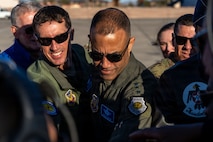 Group of Airmen are gathered together.