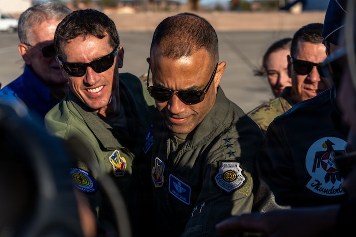 Group of Airmen are gathered together.