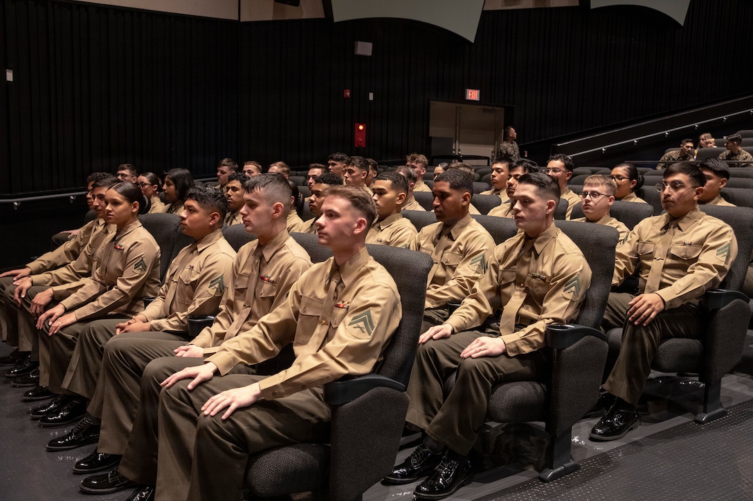 U.S. Marines from Marine Corps Air Station Iwakuni, Corporals Course Class 3-26, sit during their graduation ceremony at the Sakura Theater, MCAS Iwakuni, Japan, Feb. 27, 2026. Corporals Course provides leadership development and professional military education, preparing noncommissioned officers to effectively lead Marines and support mission readiness. (U.S. Marine Corps photo by Lance Cpl. Kenneth Garcia)
