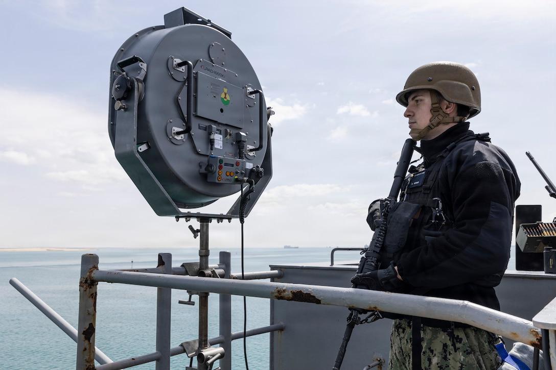 A U.S. Sailor stands small craft action team watch on a catwalk aboard the world’s largest aircraft carrier, USS Gerald R. Ford (CVN 78), while transiting the Suez Canal, March 5, 2026. (U.S. Navy photo)