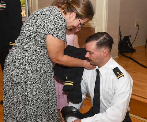 260306-N-FB730-1050 CAMP LEJEUNE. (March 6, 2026) Lt. j.g. Terry Hancock has his officer shoulder boards placed by his family during the Interservice Physicians Assistants Program (IPAP) graduation at Marston Pavilion on March 6, 2026.  Naval Medical Center Camp Lejeune serves as a Phase II site for Navy Medicine’s Interservice Physician Assistant Program. The program has graduated and commissioned more than 35 Navy officers since the program’s establishment in 2021. (U.S. Navy photo by Mass Communications Specialist second class Justin Woods)