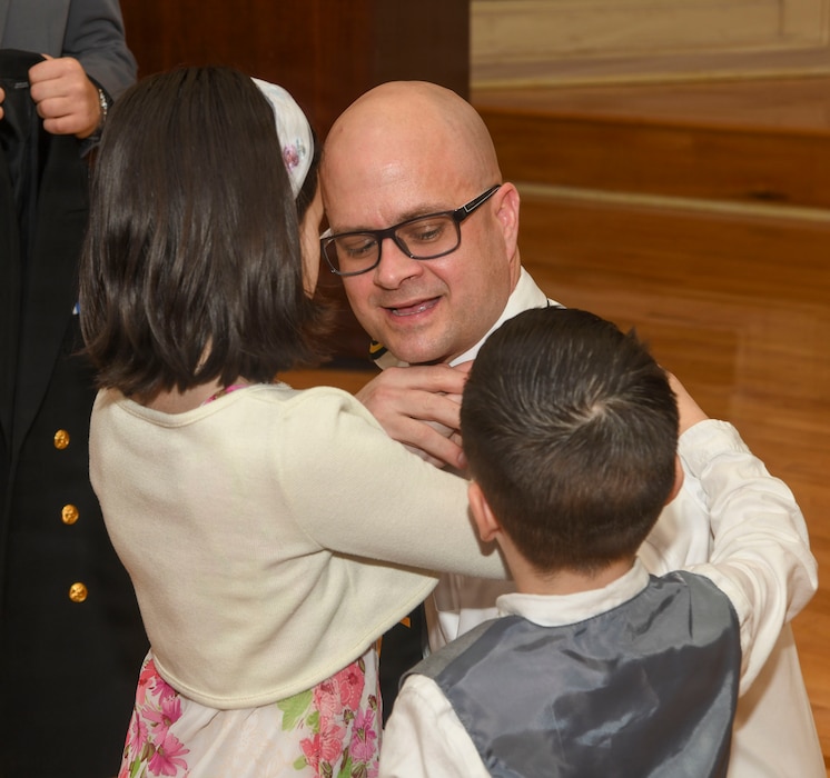 260306-N-FB730-1062 CAMP LEJEUNE. (March 6, 2026) Lt. j.g. Cory Hooper has his officer shoulder boards placed by his family during the Interservice Physicians Assistants Program (IPAP) graduation at Marston Pavilion on March 6, 2026.  Naval Medical Center Camp Lejeune serves as a Phase II site for Navy Medicine’s Interservice Physician Assistant Program. The program has graduated and commissioned more than 35 Navy officers since the program’s establishment in 2021. (U.S. Navy photo by Mass Communications Specialist second class Justin Woods)
