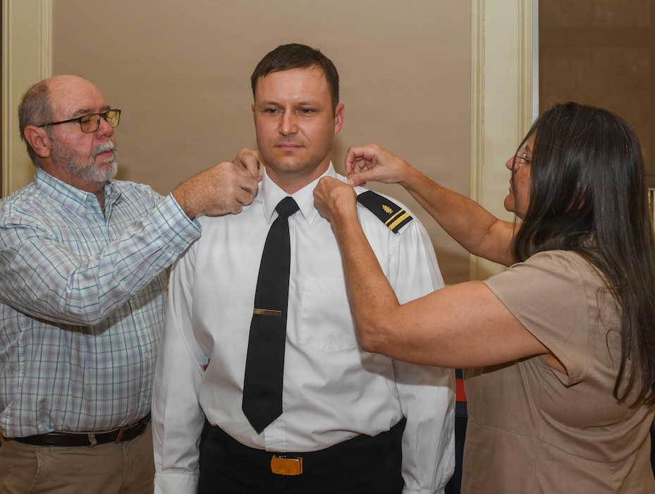 260306-N-FB730-1082 CAMP LEJEUNE. (March 6, 2026) Lt. j.g. Joshua White has his officer shoulder boards placed by his family during the Interservice Physicians Assistants Program (IPAP) graduation at Marston Pavilion on March 6, 2026. Naval Medical Center Camp Lejeune serves as a Phase II site for Navy Medicine’s Interservice Physician Assistant Program. The program has graduated and commissioned more than 35 Navy officers since the program’s establishment in 2021. (U.S. Navy photo by Mass Communications Specialist second class Justin Woods)