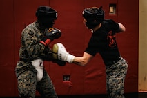 U.S. Marines with Martial Arts Instructor course 42-26 spar during the culminating event at The Basic School on Marine Corps Base Quantico, Virginia, Feb. 13, 2026. The MAI culminating event combines techniques used within the Marine Corps Martial Arts program in one final test to ensure the Marines are ready to conduct belt advancement within individual units to uphold the tradition of warrior ethos in the corps. (U.S. Marine Corps photo by Cpl. Braydon Rogers)
