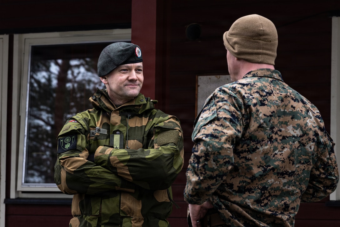 Norwegian army Lieutenant Colonel Anders Aasheim, battalion commander of Combat Service and Support Battalion (Stridstrenbataljonen), Brigade Nord, and U.S. Marine Corps Lt. Col Chase A. Bradford, commanding officer of 2nd Battalion, 6th Marine Regiment, 2nd Marine Division, converse in Setermoen, Norway, March 7, 2026. Key leaders gather to assess vehicle capabilities to enhance coordination, strengthen partnerships, and establish a shared operational understanding in preparation for exercise Cold Response 26. A key component of NATO's enhanced vigilance activity Arctic Sentry, exercise Cold Response 26 is a Norwegian-led winter military exercise designed to enhance collective defense capabilities and ensure U.S. readiness to rapidly deploy and seamlessly operate alongside NATO Allies in challenging arctic conditions. (U.S. Marine Corps photo by Cpl. Judith Ann Lazaro)