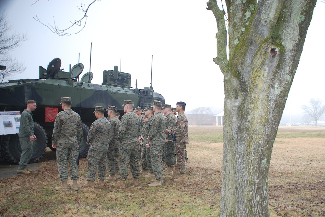 Marine Corps Systems Command, Program Office of Advanced Amphibious Assault, speaks to students with Fox Company, Basic Officer Course 6-25 during Amphibious Combat Vehicle integration training at TBS on Marine Corps Base Quantico, Virginia, March 5, 2026. Students had the opportunity to speak with subject matter experts and observe the Amphibious Combat Vehicle—Command variant to learn more about the capabilities and limitations of the ACV-C and the rest of the family of vehicles, and how they will be implemented/operated within the Fleet Marine Force. (U.S. Marine Corps photo by Sgt. Myra Walker)