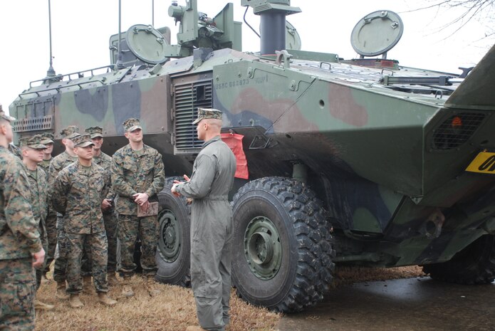 Marine Corps Systems Command, Program Office of Advanced Amphibious Assault, speaks to students with Fox Company, Basic Officer Course 6-25 during Amphibious Combat Vehicle integration training at TBS on Marine Corps Base Quantico, Virginia, March 5, 2026. Students had the opportunity to speak with subject matter experts and observe the Amphibious Combat Vehicle—Command variant to learn more about the capabilities and limitations of the ACV-C and the rest of the family of vehicles, and how they will be implemented/operated within the Fleet Marine Force. (U.S. Marine Corps photo by Sgt. Myra Walker)