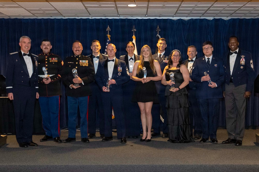 Gen. Stephen Whiting, commander, U.S. Space Command and Chief Master Sgt. Jacob Simmons, chief senior enlisted leader for U.S. Space Command, pose with the 2025 Apollo Award recipients during USSPACECOM’s Galactic Gala at the Hub in Colorado Springs, Colorado, February 19, 2026. The theme of the gala was “250 Years of Trailblazing” and featured the 2025 USSPACECOM Apollo Awards. USSPACECOM, working with Allies and Partners, plans, executes, and integrates military spacepower into multi-domain global operations in order to deter aggression, defend national interests, and when necessary, defeat threats. (USSPACECOM photo by Mass Communication Specialist 1st Class Shannon Burns)