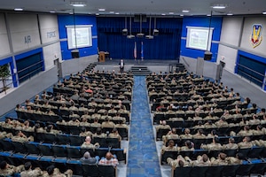 Retired U.S. Air Force Col. Raymond Strasburger delivers a speech during Saluting Our Aviation Roots (SOAR) Week at Moody Air Force Base, Georgia, Feb. 26, 2026. Strasburger highlighted the importance of leadership and personal responsibility, encouraging Airmen to carry forward the standards set by those who served before them. (U.S. Air Force photo by Senior Airman Leonid Soubbotine)