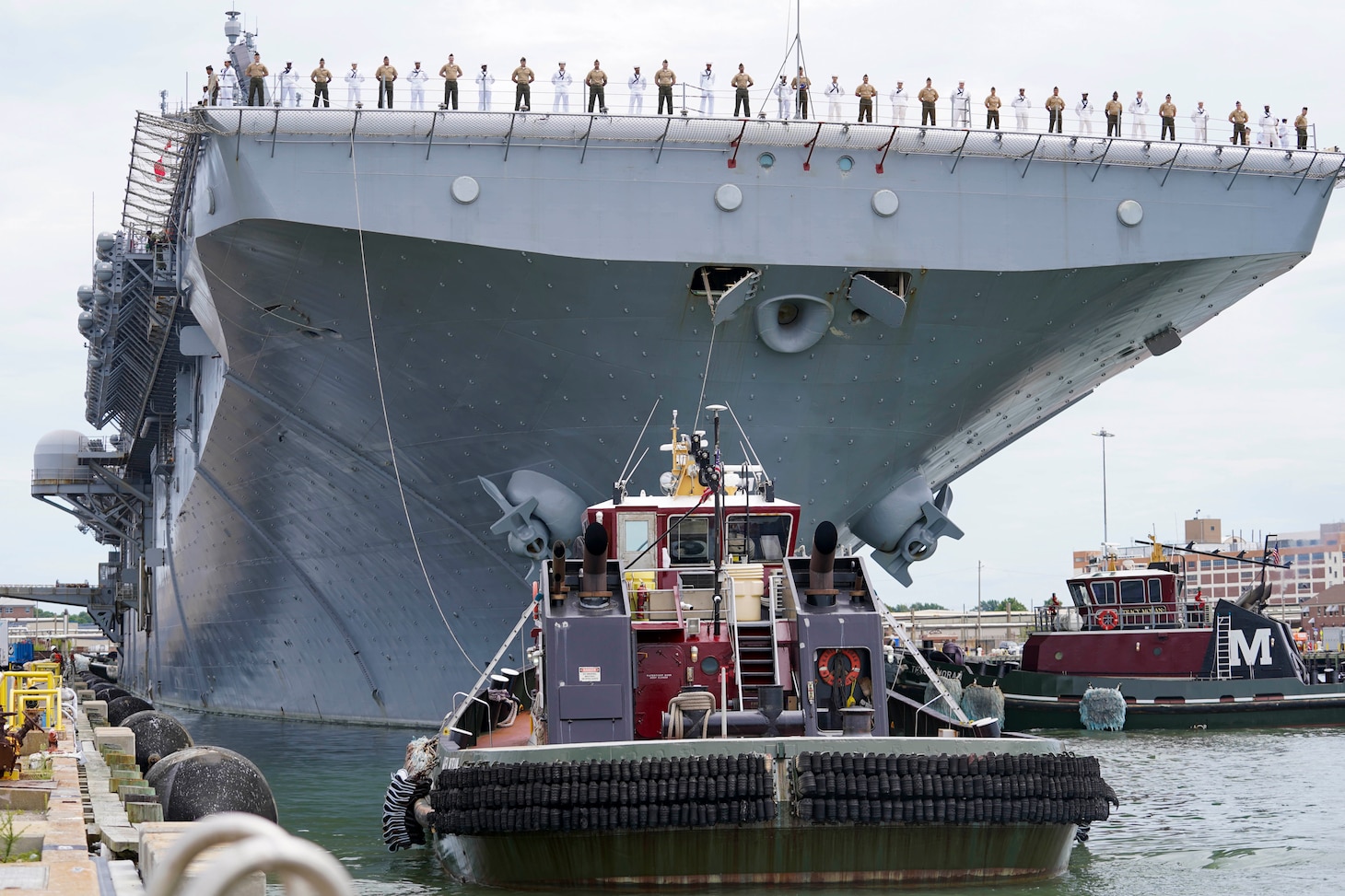 NORFOLK, Va. (Aug. 14, 2025) - Sailors and Marines man the rails aboard the Wasp-class amphibious assault ship USS Iwo Jima (LHD 7) as it departs Naval Station Norfolk for a regularly scheduled deployment. Sailors and Marines of the Iwo Jima Amphibious Ready Group (IWO ARG) - 22nd Marine Expeditionary Unit (MEU) Special Operations Capable (SOC) departed Norfolk and Camp Lejeune, North Carolina after completing a comprehensive, nine-month training program. (U.S. Navy photo by Mass Communication Specialist 1st Class Clay Whaley)