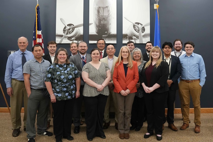 a group of employees pose together