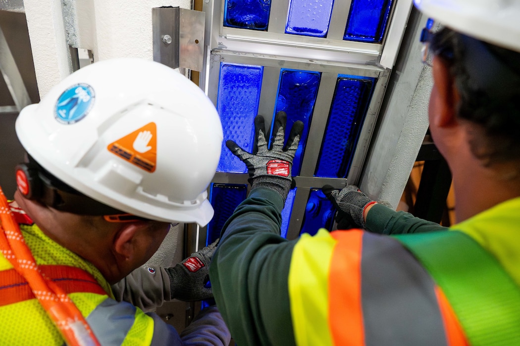 U.S. AIR FORCE ACADEMY, Colo. – Restoration specialists carefully reinstall the first of 2,240 cassettes with more than 24,000 individual dalles de verre blocks, commonly referred to as stained glass panels, inside the U.S. Air Force Academy Cadet Chapel. The installation is part of the on-going Air Force Installation and Mission Support Center-led Chapel restoration project. The Air Force Civil Engineer Center, an AFIMSC primary subordinate unit, is executing the restoration activities.