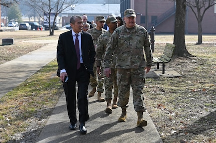 photo of U.S. Air Force service members and civilians walking down a sidewalk