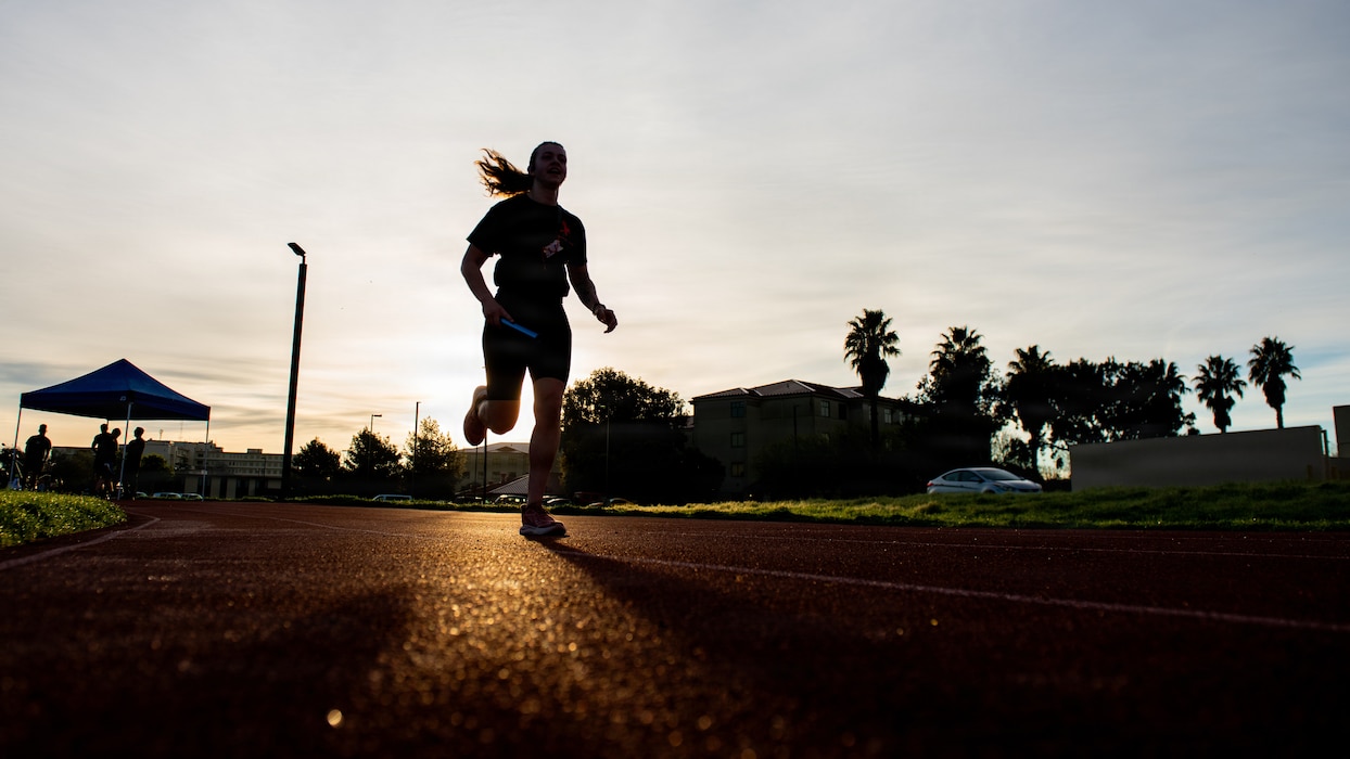 Airman runs along track