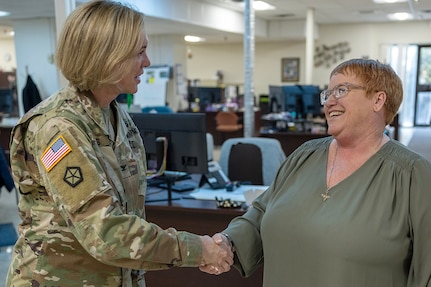 Col. Michelle M. Williams, U.S. Army Financial Management Command commander, presents a commander’s challenge coin to Dawn Martin, USAFMCOM Fort Knox Army Military Pay Office quality review analyst, at Fort Knox, Ky., March 4, 2026. USAFMCOM’s leadership visited the Fort Knox AMPO during a major subordinate command update to the U.S. Army Materiel Command and thanked the employees for their hard work in supporting Soldiers and their families. (U.S. Army photo by Mark R. W. Orders-Woempner)