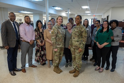 Col. Michelle M. Williams, U.S. Army Financial Management Command commander, and Command Sgt. Maj. Joy L. Allen, USAFMCOM senior enlisted advisor, pose for a photo with Fort Knox Army Military Pay Office employees at Fort Knox, Ky., March 4, 2026. Pictured from left to right are Gennaro Penn, USAFMCOM Military Pay Operations director; Thomas Johnson, USAFMCOM Fort Knox AMPO military pay technician; Diana Stuart, USAFMCOM Fort Knox AMPO lead military pay technician; Ronda Rosenfeld, USAFMCOM Fort Knox AMPO customer service supervisor; Timothy Thompson, USAFMCOM Fort Knox AMPO computer assistant; Williams; Dawn Martin, USAFMCOM Fort Knox AMPO quality review analyst; Sharon Pettaway, USAFMCOM Fort Knox AMPO deputy chief; Allen; Cynthia Bujarski, USAFMCOM Fort Knox AMPO military pay technician; Michael Piper, USAFMCOM Fort Knox AMPO in- and out-processing and separations supervisor; Sherrie Parks, USAFMCOM Fort Knox AMPO military pay technician; Tracy Tweedy, USAFMCOM Fort Knox AMPO military pay technician; and Wendy Cherry, USAFMCOM Fort Knox AMPO chief. (U.S. Army photo by Mark R. W. Orders-Woempner)