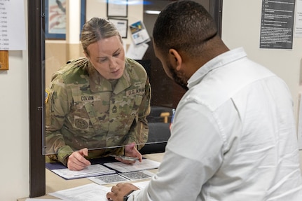 Thomas Johnson, U.S. Army Financial Management Command Fort Knox Army Military Pay Office military pay technician, provides support to Master Sgt. Krista L. Colvin, U.S. Army Recruiting Division active guard and reserve strength manager, at Fort Knox, Ky., March 3, 2026. USAFMCOM’s AMPOs perform installation-level military pay support for the Army across the United States, Korea and Japan. (U.S. Army photo by Mark R. W. Orders-Woempner)