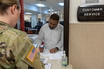Thomas Johnson, U.S. Army Financial Management Command Fort Knox Army Military Pay Office military pay technician, provides support to Master Sgt. Krista L. Colvin, U.S. Army Recruiting Division active guard and reserve strength manager, at Fort Knox, Ky., March 3, 2026. USAFMCOM’s AMPOs perform installation-level military pay support for the Army across the United States, Korea and Japan. (U.S. Army photo by Mark R. W. Orders-Woempner)