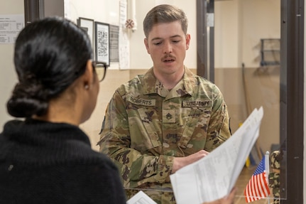 Sherrie Parks, U.S. Army Financial Management Command Fort Knox Army Military Pay Office military pay technician, provides support to Staff Sgt. Austin C. Roberts, 244th Expeditionary Combat Aviation Brigade wheeled vehicle mechanic, at Fort Knox, Ky., March 3, 2026. USAFMCOM’s AMPOs perform installation-level military pay support for the Army across the United States, Korea and Japan. (U.S. Army photo by Mark R. W. Orders-Woempner)