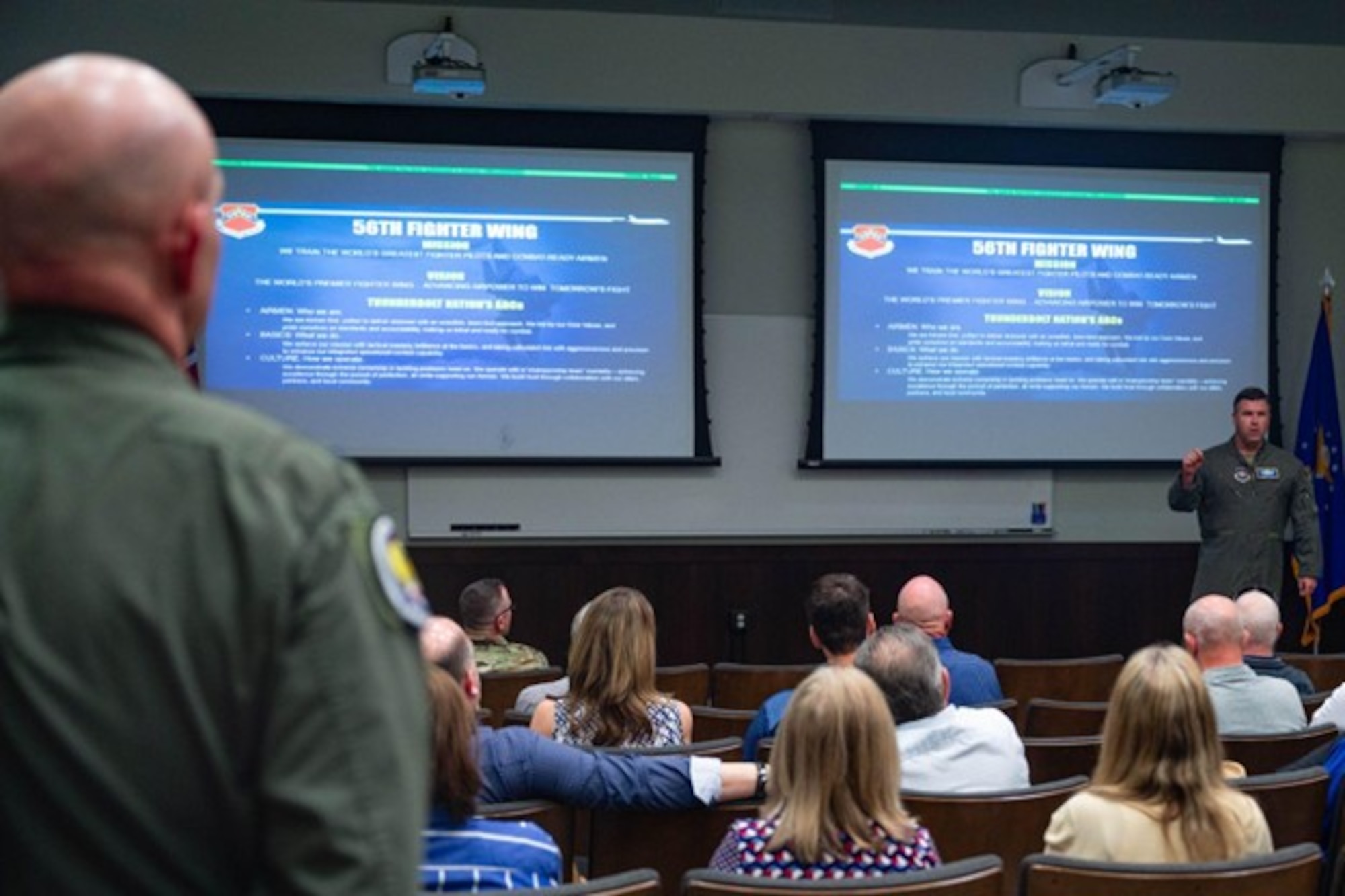 Col. John Ryan, 56th Fighter Wing deputy commander, briefs civic leaders from across the country and Lt. Gen. Clark Quinn, commander of Air Education and Training Command, Feb. 26, 2026, at Luke Air Force Base, Arizona. The 56th FW, the Air Force’s largest F-35 training wing, trains the world’s greatest fighter pilots and combat-ready Airmen while strengthening partnerships with allied nations. Wing leadership emphasized that Luke AFB’s mission extends beyond pilot qualification, developing Airmen prepared to operate and lead in complex, coalition-driven combat environments.
