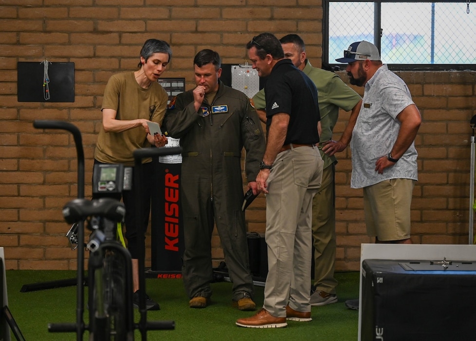 Civic Leaders from across the United States speak with Luke Air Force Base Airmen about training and human performance initiatives inside the Tactical Integrated Training and Nutrition (TITAN) Arena during a civic leader tour at Luke Air Force Base, Arizona. The visit provided community leaders a firsthand look at how Luke AFB develops the world’s greatest fighter pilots and combat-ready Airmen in support of Air Education and Training Command’s mission.