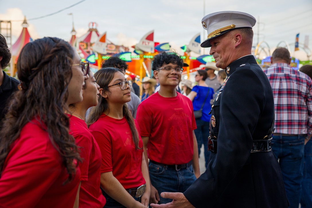 U.S. Marine Corps Lt. Gen. Leonard F. Anderson IV, commander of Marine Forces Reserve and Marine Forces South, talks with newly sworn-in Marine recruits at the Houston Livestock Show and Rodeo Armed Forces Appreciation Day in Houston, March 4, 2026. Armed Forces Appreciation Day honored nearly 4,000 military personnel and veterans, including a joint service enlistment ceremony for approximately 500 recruits. (U.S. Marine Corps photo by SSgt. Ethan M. LeBlanc)