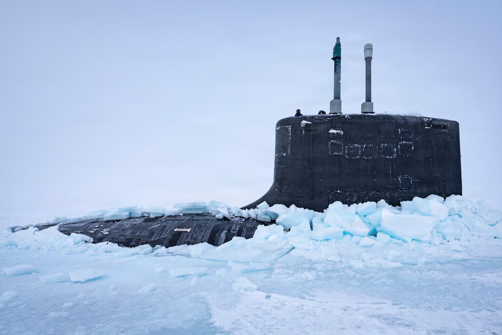ARCTIC CIRCLE - Virginia-class fast-attack submarine USS Delaware (SSN 791) emerges from the ice after performing a vertical surfacing to kick off Operation ICE CAMP 2026, Mar. 7. ICE CAMP Boarfish is a three-week operation designed to research, test, and evaluate operational capabilities in the Arctic region. In addition to U.S. Navy, U.S. Marine Corps, and Air National Guard participation, personnel from the Royal Australian Navy, Royal Canadian Navy, Royal Canadian Air Force, French Navy, Royal United Kingdom Navy, Norwegian Defence Research Institute, and the Japan Agency for Marine-Earth Science and Technology are also taking part. This operation, held biennially, partners with the Arctic Submarine Laboratory and was elevated from an exercise to an operation to better reflect the Navy’s strategic priorities in the Arctic. ICE CAMP provides the necessary training to maintain a working knowledge of a constantly changing region. (U.S. Navy Photo by Mass Communication Specialist 1st Class Jacob D. Bergh)