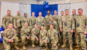 U.S. Air Force Senior Master Sergeant selects pose for a photo at Moody Air Force Base, Valdosta, March 06, 2026. The newly promoted Senior Master Sergeants gathered to celebrate their promotion with a release party where family members and teammates gathered to show their support. (U.S. Air Force photo by Senior Airman Sir Wyrick)