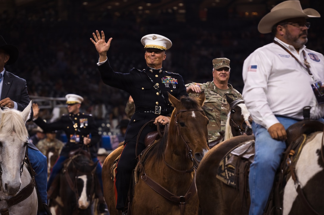 U.S. Marine Corps Lt. Gen. Leonard F. Anderson IV, commander of Marine Forces Reserve and Marine Forces South, rides into the main rodeo arena during the Houston Livestock Show and Rodeo Grand Entry on Armed Forces Appreciation Day in Houston, March 4, 2026. The Armed Forces Appreciation Day is a display of community support for the military, the participation of the commander and senior enlisted leader in the Grand Entry underscores the significance of this day and the city's deep gratitude for the dedication of America's troops. (U.S. Marine Corps photo by SSgt. Ethan M. LeBlanc)