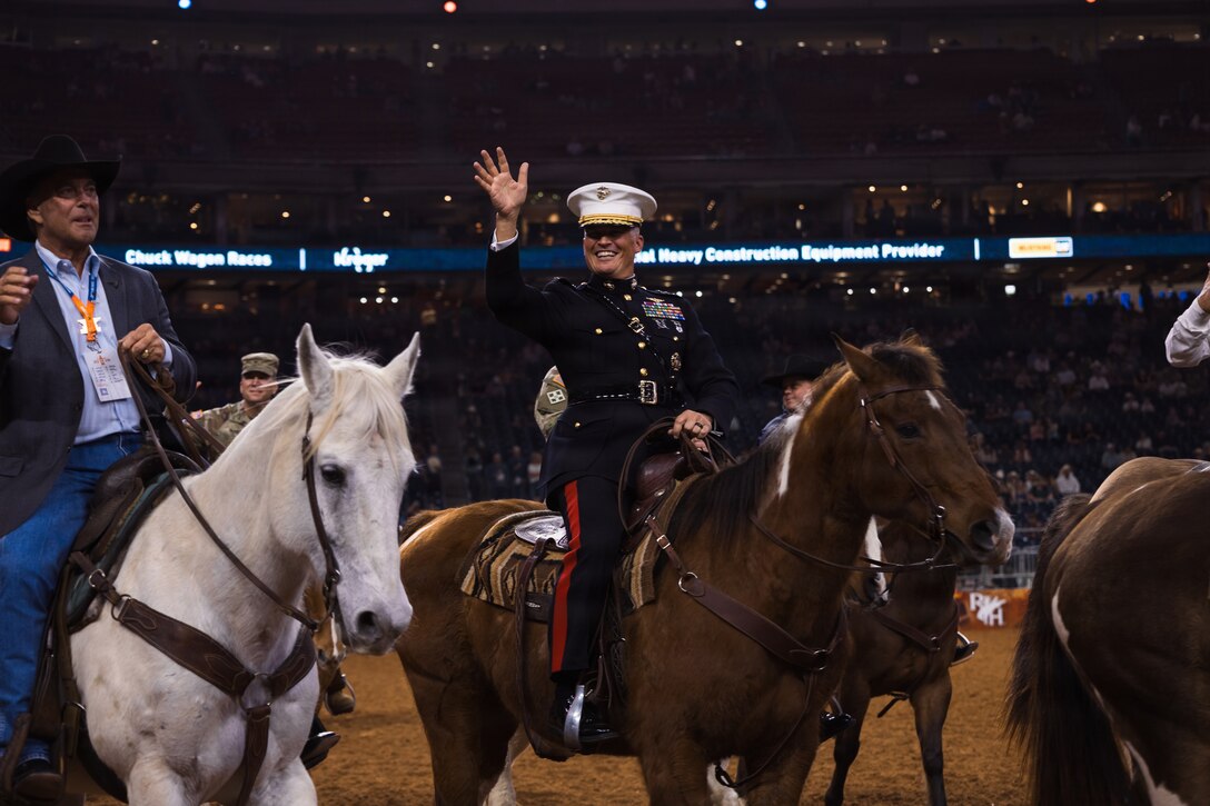 U.S. Marine Corps Lt. Gen. Leonard F. Anderson IV, commander of Marine Forces Reserve and Marine Forces South, waves to the crowd in the main rodeo arena during the Houston Livestock Show and Rodeo Grand Entry on Armed Forces Appreciation Day in Houston, March 4, 2026. The Armed Forces Appreciation Day is a display of community support for the military, the participation of the commander and senior enlisted leader in the Grand Entry underscores the significance of this day and the city's deep gratitude for the dedication of America's troops. (U.S. Marine Corps photo by SSgt. Ethan M. LeBlanc)