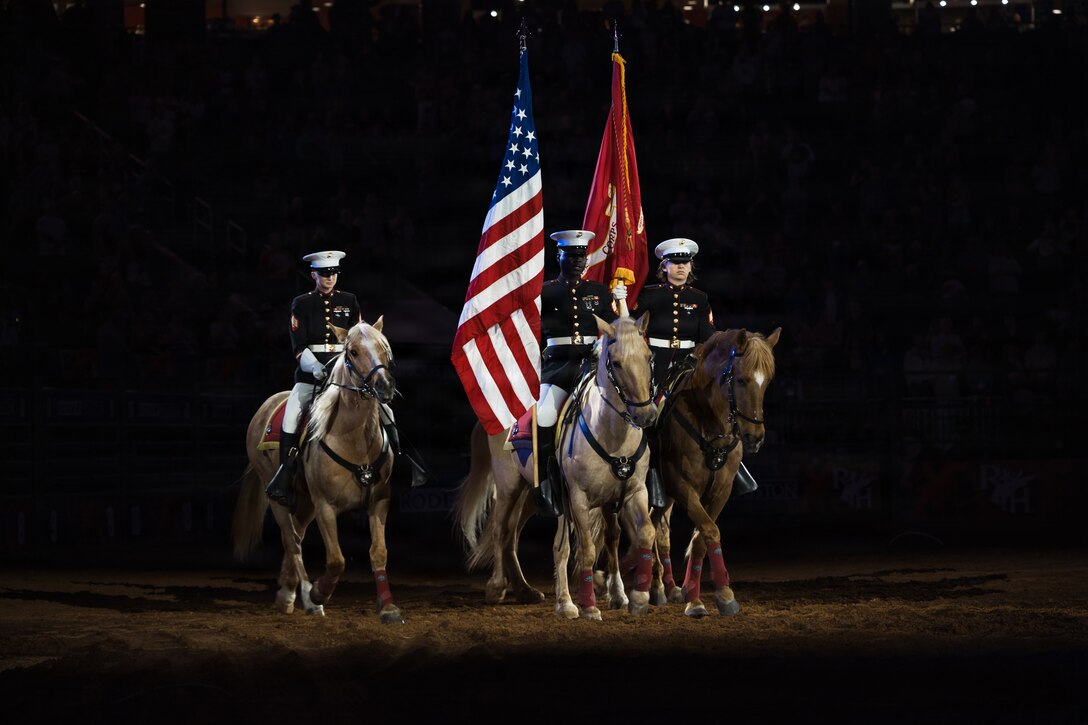 The U.S. Marine Corps Mounted Color Guard presents the colors during the playing of the National Anthem at the Houston Livestock Show and Rodeo Grand Entry on Armed Forces Appreciation Day in Houston, March 4, 2026. The participation of the last Marine mounted color guard in the Grand Entry, underscores the significance of this day and the city's deep gratitude for the dedication of America's troops. (U.S. Marine Corps photo by SSgt. Ethan M. LeBlanc)