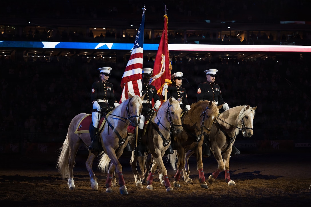 The U.S. Marine Corps Mounted Color Guard presents the colors during the playing of the National Anthem at the Houston Livestock Show and Rodeo Grand Entry on Armed Forces Appreciation Day in Houston, March 4, 2026. The participation of the last Marine mounted color guard in the Grand Entry, underscores the significance of this day and the city's deep gratitude for the dedication of America's troops. (U.S. Marine Corps photo by SSgt. Ethan M. LeBlanc)