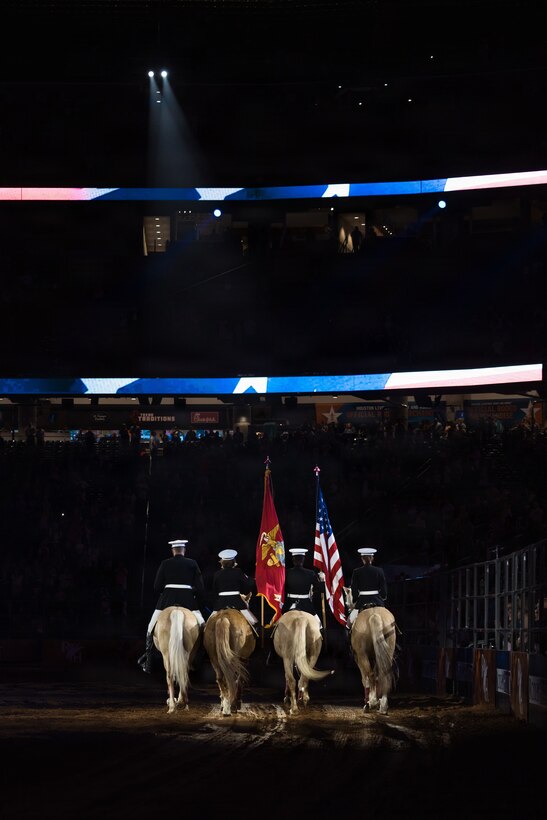 The U.S. Marine Corps Mounted Color Guard presents the colors during the playing of the National Anthem at the Houston Livestock Show and Rodeo Grand Entry on Armed Forces Appreciation Day in Houston, March 4, 2026. The participation of the last Marine mounted color guard in the Grand Entry, underscores the significance of this day and the city's deep gratitude for the dedication of America's troops. (U.S. Marine Corps photo by SSgt. Ethan M. LeBlanc)