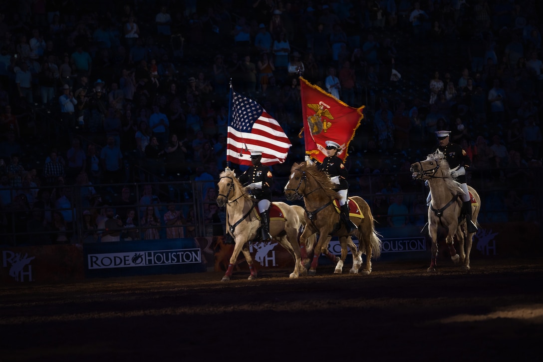 The U.S. Marine Corps Mounted Color Guard presents the colors during the playing of the National Anthem at the Houston Livestock Show and Rodeo Grand Entry on Armed Forces Appreciation Day in Houston, March 4, 2026. The participation of the last Marine mounted color guard in the Grand Entry, underscores the significance of this day and the city's deep gratitude for the dedication of America's troops. (U.S. Marine Corps photo by SSgt. Ethan M. LeBlanc)