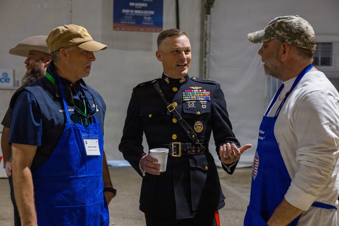U.S. Marine Corps Lt. Gen. Leonard F. Anderson IV, commander of Marine Forces Reserve and Marine Forces South, talks with rodeo staff at the Houston Livestock Show and Rodeo Armed Forces Appreciation Day in Houston, March 4, 2026. Armed Forces Appreciation Day honored nearly 4,000 military personnel and veterans, including a joint service enlistment ceremony for approximately 500 recruits. (U.S. Marine Corps photo by SSgt. Ethan M. LeBlanc)