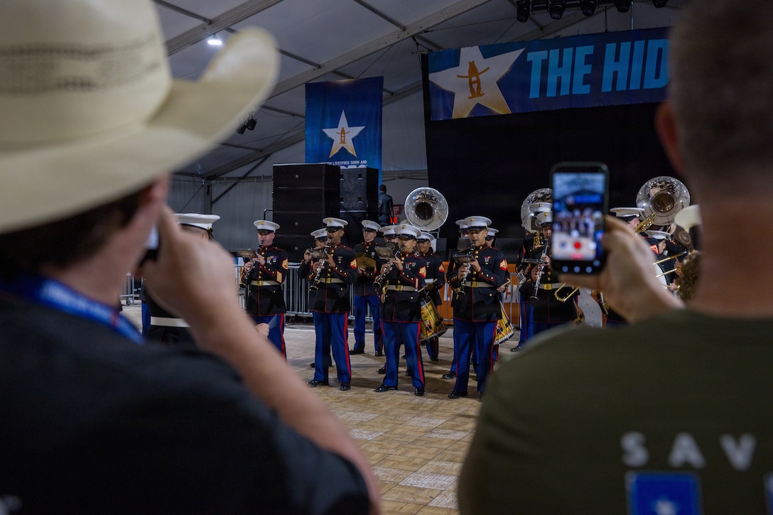 The U.S. Marine Forces Reserve band performs for servicemembers and veterans at the Houston Livestock Show and Rodeo Armed Forces Appreciation Day in Houston, March 4, 2026. Armed Forces Appreciation Day honored nearly 4,000 military personnel and veterans, including a joint service enlistment ceremony for approximately 500 recruits. (U.S. Marine Corps photo by SSgt. Ethan M. LeBlanc)