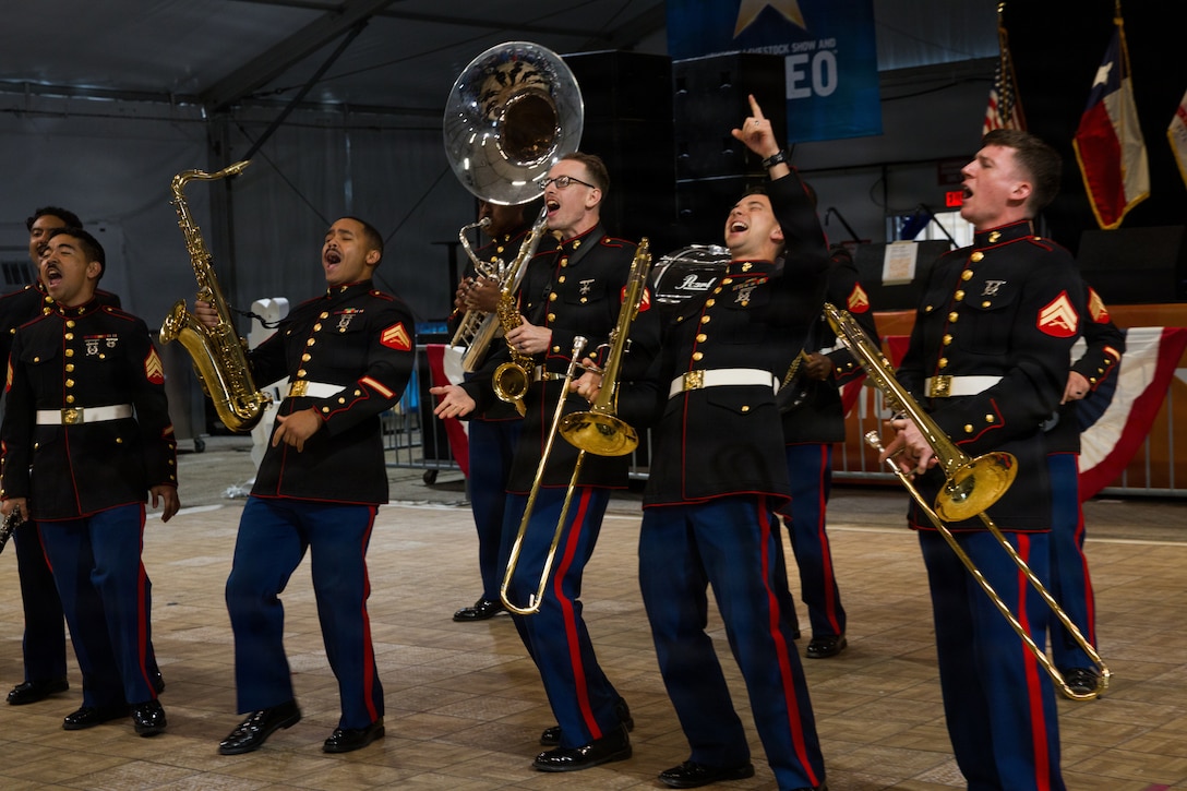 The U.S. Marine Forces Reserve Band performs for servicemembers and veterans at the Houston Livestock Show and Rodeo Armed Forces Appreciation Day in Houston, March 4, 2026. Armed Forces Appreciation Day honored nearly 4,000 military personnel and veterans, including a joint service enlistment ceremony for approximately 500 recruits. (U.S. Marine Corps photo by SSgt. Ethan M. LeBlanc)